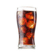 Cola with ice in glass isolated on white background